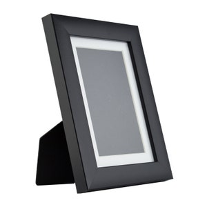Craig Frames 1WB3BK 8.5 x 11 Inch Black Picture Frame Matted to Display a 6 x 9 Inch Photo Craig Frames 1WB3BK 8.5 x 11 Inch Black Picture Frame Matted to Display a 6 x 9 Inch Photo