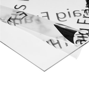 May include: Clear acrylic sheet with protective film still attached. The film has the words "The Original Frame" printed on it.