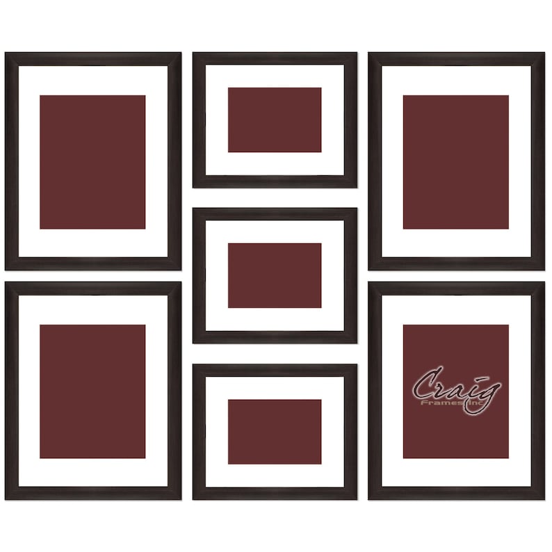 May include: A set of six black picture frames with white mats, arranged in a collage pattern. The frames are empty and have a dark brown background.