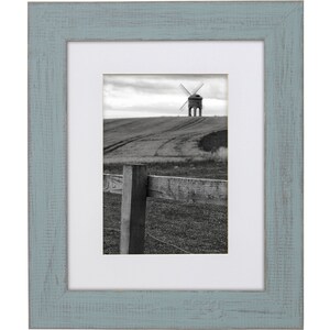 a black and white photo of a windmill