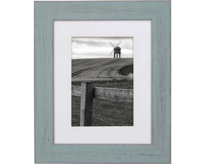 a black and white photo of a windmill