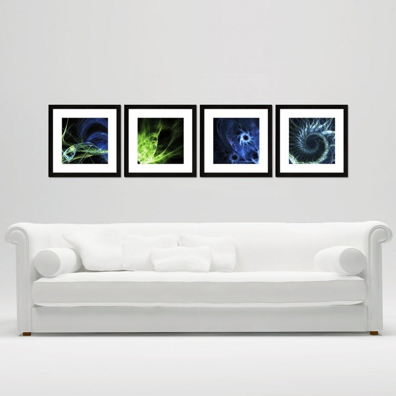 May include: Four black framed abstract art prints with green and blue swirling designs. The prints are hanging on a white wall above a white couch.