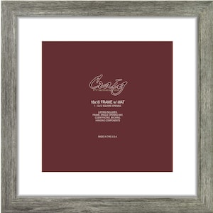 May include: A gray wood picture frame with a white mat and a 12x12 inch opening. The frame is made in the USA. The text on the frame reads "Craig Frames 16x16 FRAME w/ MAT 1-12-12 SQUARE OPENING LISTING INCLUDES FRAME SINGLE OPENING MAT CLEAR FACING BACKING HANGING COMPONENTS MADE IN THE USA."