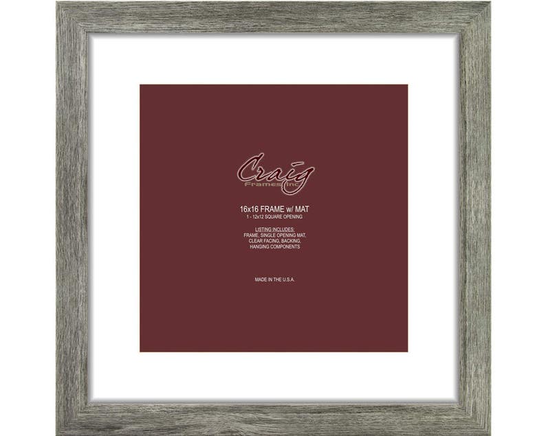 May include: A gray wood picture frame with a white mat and a 12x12 inch opening. The frame is made in the USA. The text on the frame reads "Craig Frames 16x16 FRAME w/ MAT 1-12-12 SQUARE OPENING LISTING INCLUDES FRAME SINGLE OPENING MAT CLEAR FACING BACKING HANGING COMPONENTS MADE IN THE USA."