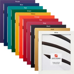 May include: A set of 11 picture frames in various colors, including purple, blue, teal, green, yellow, orange, red, pink, black, gold, and white. The frames are all the same size and have a simple, modern design. The frames are arranged in a diagonal line, with the white frame at the bottom right. The white frame has the text "CRAIG FRAMES" and "hangs vertical or horizontal" printed on it.
