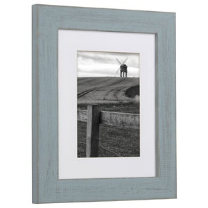 a picture frame with a picture of a windmill