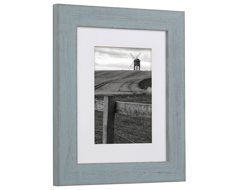 a picture frame with a picture of a windmill