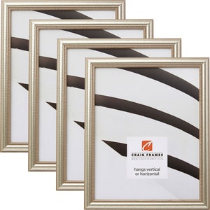 May include: Set of four silver picture frames with a beaded edge. The frames are arranged in a staggered pattern. The frames are designed to hang vertically or horizontally. The text on the frame reads "Craig Frames" and "hangs vertical or horizontal".