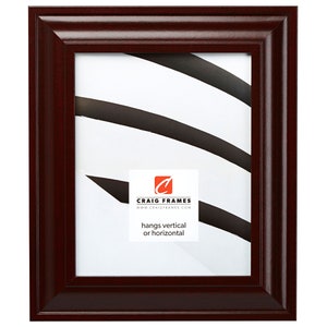May include: A dark mahogany wood picture frame with a simple, slightly raised, beveled edge. The frame is designed to hang vertically or horizontally. The frame is made by Craig Frames.