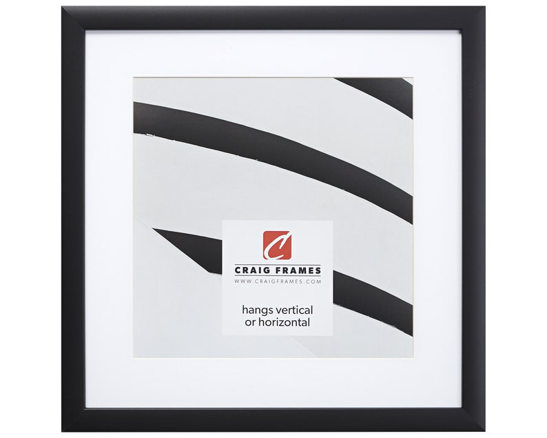 May include: Black picture frame with a white mat and a white background. The frame has a simple design and is suitable for hanging both vertically and horizontally. The text on the frame reads "Craig Frames" and "www.craigframes.com".