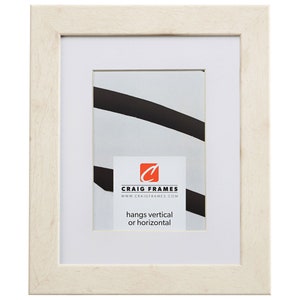 May include: A white wood picture frame with a white mat. The frame is ready to hang vertically or horizontally. The frame has a Craig Frames logo and website address on the mat.