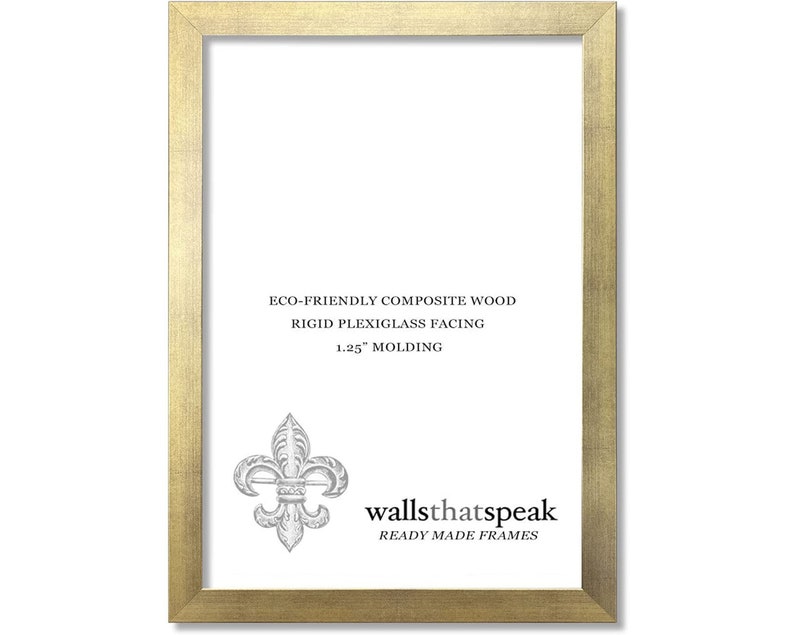 May include: Gold picture frame with a 1.25 inch molding. The frame is made of eco-friendly composite wood with a rigid plexiglass facing. The frame has a fleur-de-lis design in the bottom right corner and the text "wallsthatspeak READY MADE FRAMES".