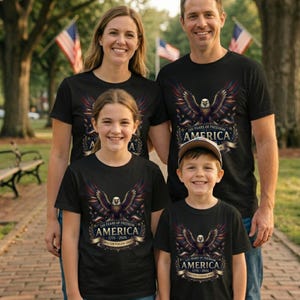 May include: Black t-shirts featuring a graphic of a bald eagle with spread wings above a banner that reads 250 YEARS OF FREEDOM AMERICA 1776-2026. The design includes red, white, and blue accents and stars, displayed on four matching shirts.
