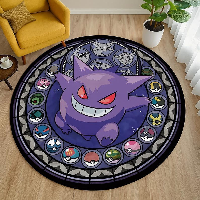 May include: A round, purple and black rug featuring a smiling Gengar character with red eyes. The rug has a stained glass design with various Pokemon characters and Poke Balls around the border. The rug is on a wooden floor.