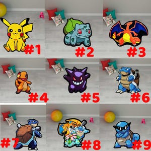 May include: A collection of nine colorful character rugs, each featuring a different Pok&eacute;mon design. The rugs are in various shapes and sizes, with vibrant colors and detailed illustrations. Each rug has a number from 1 to 9.
