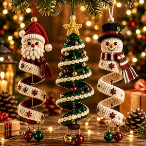 May include: Three hanging crochet ornaments featuring a Santa Claus, a green Christmas tree with a yellow star, and a snowman wearing a black top hat. Each ornament has a spiral base decorated with small embroidered flowers and dangling baubles.
