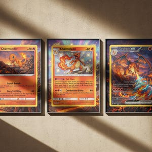 May include: Three framed wall art prints featuring Pokémon trading cards. The left print shows Charmander, the center print shows Charmeleon, and the right print shows Charizard EX. Each card displays its name, HP, attacks, and fire-themed artwork.