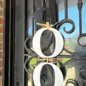This is a picture of the back side of the letters. The B is painted black and both Os are painted white. Painting the back side is an extra fee.