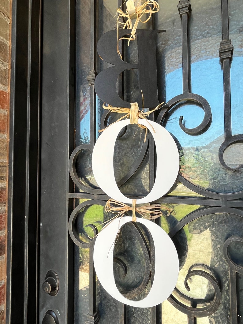 This is a picture of the back side of the letters. The B is painted black and both Os are painted white. Painting the back side is an extra fee.