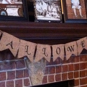 This is a burlap banner that says halloween. The burlap is a natural color with hand painted letters in black. The font is super fun with fun accents on each letter.