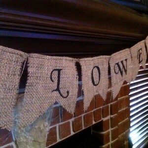 This is a burlap banner that says halloween. The burlap is a natural color with hand painted letters in black. The font is super fun with fun accents on each letter.