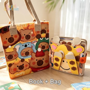 May include: A felt tote bag featuring a repeating pattern of cartoon bears in various hats and a square felt book with a yellow giraffe face on the cover. The bag has beige fabric handles and the text "Sweet GrowCraft" and "Book + Bag".