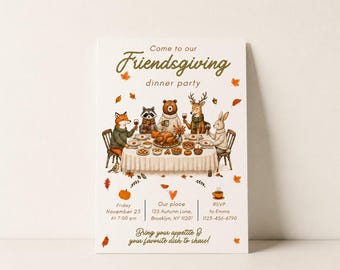 May include: A Friendsgiving dinner party invitation card featuring a watercolor illustration of a fox, raccoon, bear, deer, and rabbit sitting at a table with a feast. The text reads Come to our Friendsgiving dinner party, Friday November 23 at 7:00 pm, Our place 123 Autumn Lane, Brooklyn, NY 11201, RSVP to Emma 1123-456-6790, and Bring your appetite & your favorite dish to share!