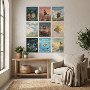 May include: A collection of nine rectangular movie posters arranged in a grid on a wall. The posters feature colorful animated scenes with titles including My Neighbor Totoro, Kiki's Delivery Service, Howl's Moving Castle, The Wind Rises, Spirited Away, Castle in the Sky, Princess Mononoke, Ponyo, and Nausica&auml; of the Valley of the Wind.