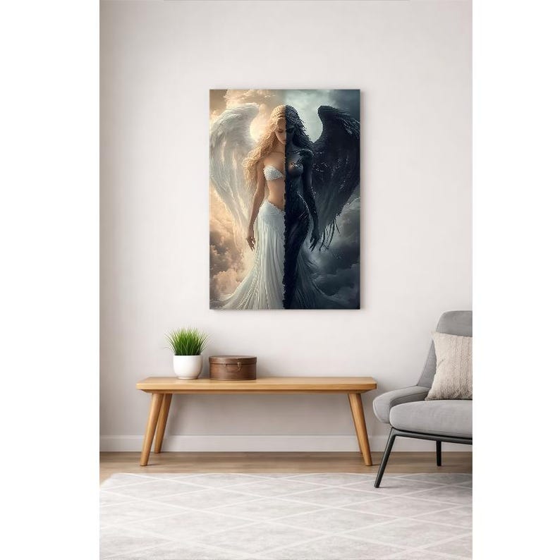 May include: A rectangular wall art print featuring a split-figure composition. One side depicts a light-skinned figure with large white wings against a bright sky, while the other side shows a dark-skinned figure with black wings against a stormy sky.