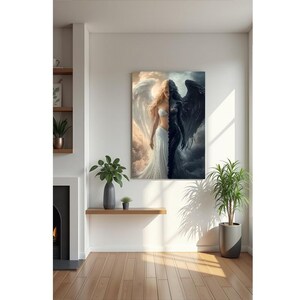 May include: A rectangular wall art print featuring a split composition of a light-skinned figure with large white wings against a bright sky on the left and a dark-skinned figure with large black wings against a stormy sky on the right.