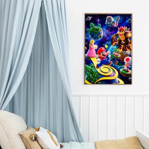 May include: A framed print featuring a vibrant scene with characters from the Super Mario video game series. Mario, Luigi, Princess Peach, Bowser, and Toad are depicted in a colorful, space-themed environment. The artwork is displayed in a child's bedroom.