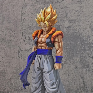 May include: A standing anime figurine featuring a character with spiky golden hair, a black and orange vest, and a blue sash tied around the waist. The figure wears loose grey trousers, blue wristbands, blue leg wraps, and black shoes with white soles.