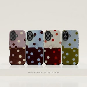 May include: Four phone cases with a two-tone design and polka dots. The top half of each case is a different color, with the bottom half a contrasting color. The cases are in shades of brown, blue, red, and green.