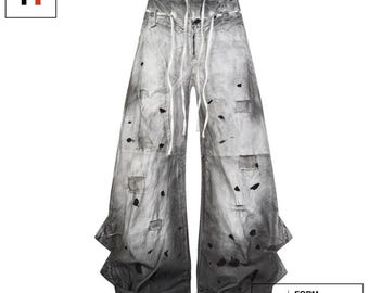 Slitna jeans med vida ben i grått