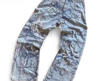 Jeans a gamba larga con grafica Angel
