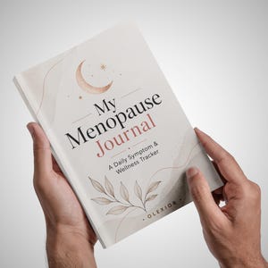 May include: A softcover book titled My Menopause Journal: A Daily Symptom & Wellness Tracker. The cover is off-white with a rose gold crescent moon, stars, and leaf illustrations. The text OLEXIOR is printed at the bottom right corner.