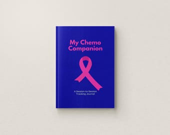 May include: A blue journal with the title My Chemo Companion printed in pink text. A pink awareness ribbon is centered below the title. The subtitle A Session-to-Session Tracking Journal is printed in white text at the bottom of the cover.