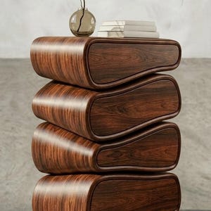 May include: A trio of ceramic mugs with a speckled, matte finish in cream, light grey, and dark grey. Each mug features a simple, minimalist design, ideal for tea or coffee.