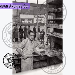 1940s Small-Town Bakery at Sunrise | Vintage Baker Pulling Fresh Bread from Oven | Americana Kitchen Wall Art