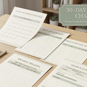 May include: A 30-day no-spend challenge money saving workbook with printed pages including a calendar, money saved tracker, impulse purchase tracker, spending triggers list, and savings goal sheet, accompanied by a calculator, pens, and a coffee cup.