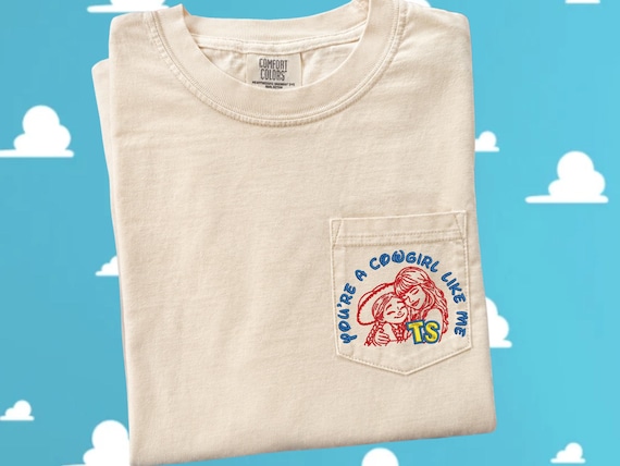 Embroidered pocket T-shirt, TS5, You're a Cowgirl like me, Jessie and Taylor embracing , TS design