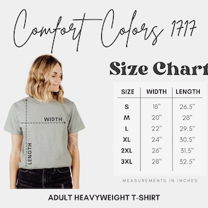 May include: A Comfort Colors 1717 adult heavyweight t-shirt size chart displaying width and length measurements in inches for sizes S through 3XL. The chart includes a visual guide on a t-shirt showing how to measure width and length dimensions.