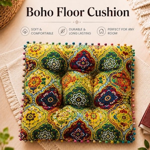 May include: A square floor cushion featuring a vibrant, multi-colored floral and geometric pattern in shades of yellow, green, red, and blue. The cushion is edged with small, multi-colored pom-poms and includes the text Boho Floor Cushion.