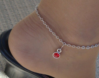 Gorgeous silvertone chain anklet with red glass accessory --adjustible.