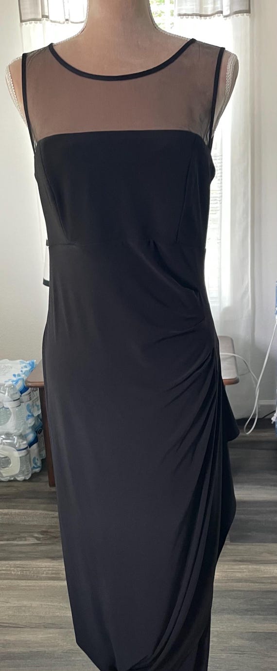 silver top black bottom dress Dressed in black, powered by confidence. REUSE BLACK AND SILVER LONG  SLEEVELESS GOWN WITH CRYSTALS AND CAPE
