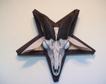 goat skull casting in a pentagram