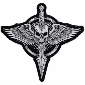 May include: A black and white embroidered patch featuring a skull with wings, a sword, and a circular background. The skull has detailed facial features, and the wings are spread wide. The sword is positioned vertically through the center of the design.