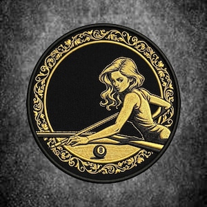 May include: A circular embroidered patch featuring a gold-coloured illustration of a person leaning over a pool table with a cue stick, aiming at an eight ball. The design is enclosed in a decorative gold filigree border on a black background.