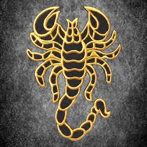 May include: An embroidered patch featuring a stylized scorpion design. The scorpion is rendered in black thread with bold, golden-yellow outlines and segmented details, showcasing two large pincers and a curved tail with a stinger at the end.