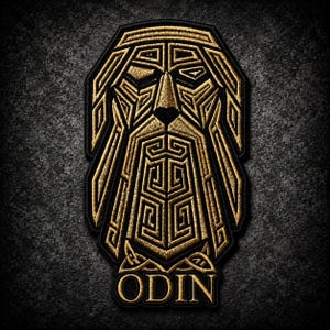 May include: An embroidered patch featuring a stylized gold-colored face with a long beard and geometric patterns on a black background. The word ODIN is stitched in gold capital letters at the bottom of the design, which has a black border.